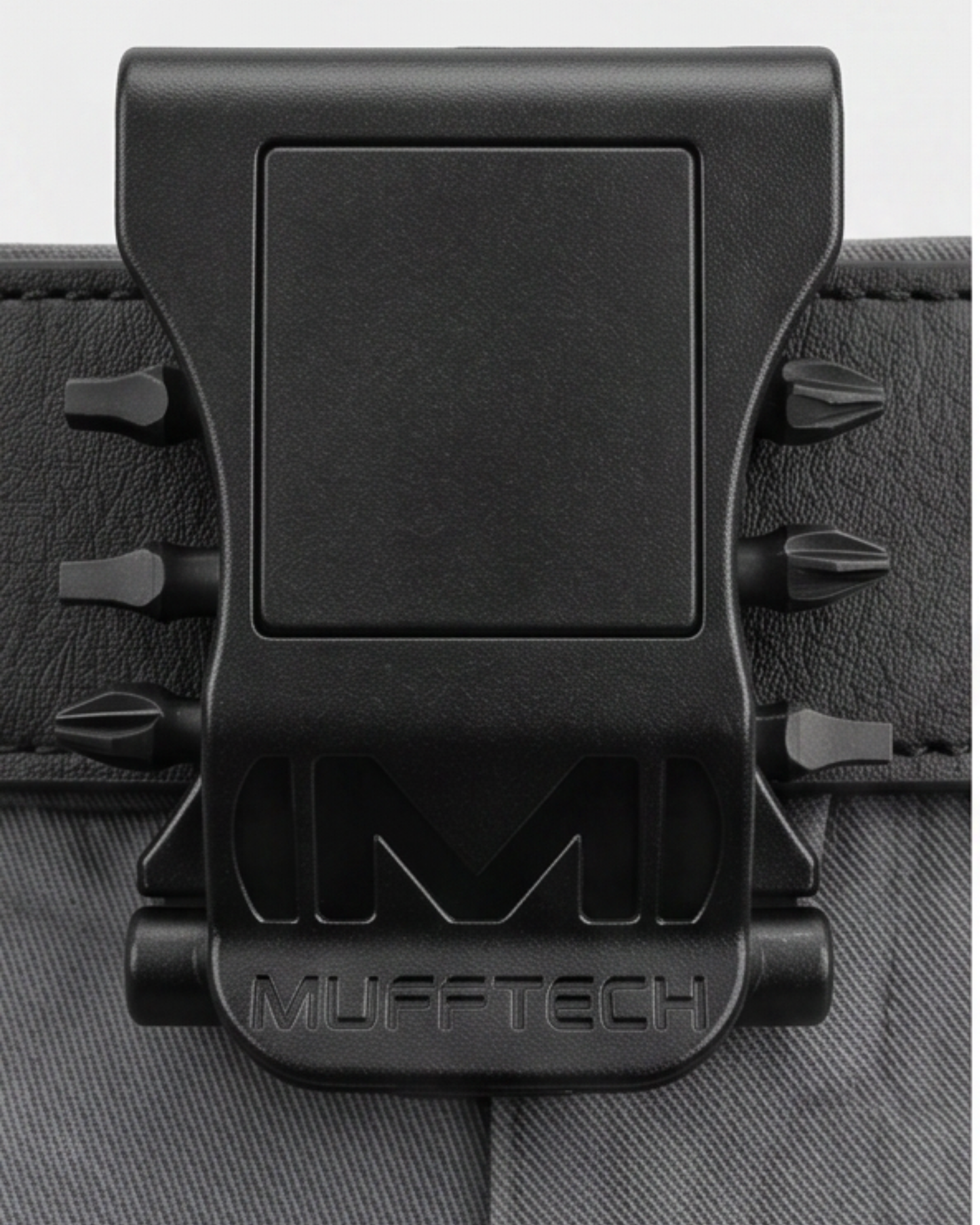 Black Mufftech product clip on a textured surface