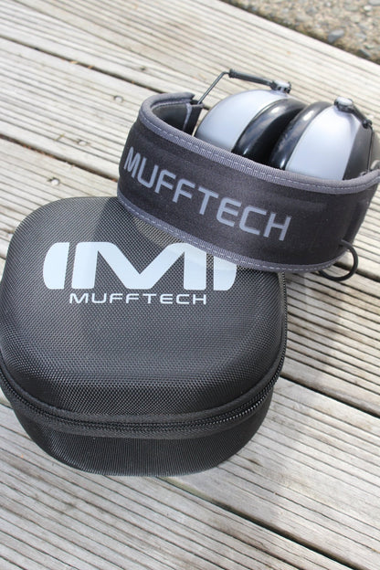 Mufftech Double OG earmuffs folded compact on top of branded carry case for easy storage